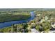 Aerial view showcasing river frontage and proximity to water, highlighting home's desirable location at 3215 Cedarbrook Dr, Punta Gorda, FL 33982
