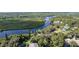 Aerial view showcasing river frontage and proximity to water, highlighting home's desirable location at 3215 Cedarbrook Dr, Punta Gorda, FL 33982