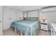 Comfortable bedroom featuring large bed, white cabinets, and cool air conditioning at 3215 Cedarbrook Dr, Punta Gorda, FL 33982