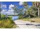 Private boat ramp access to the calm waters, surrounded by lush vegetation and the expansive river beyond at 3215 Cedarbrook Dr, Punta Gorda, FL 33982