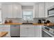 Kitchen featuring white cabinets, stainless steel appliances, and butcher block countertops and tile backsplash at 3215 Cedarbrook Dr, Punta Gorda, FL 33982