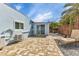 A paver patio beside the house and in front of a sliding glass door and shed offers functional space at 3215 Cedarbrook Dr, Punta Gorda, FL 33982