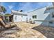 Paver patio with lawn chair featuring easy access to shed, home entrance, and outdoor shower at 3215 Cedarbrook Dr, Punta Gorda, FL 33982
