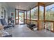A screened porch with furniture offers an airy and inviting space to relax and enjoy the outdoors at 3215 Cedarbrook Dr, Punta Gorda, FL 33982