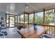 Screened porch with a ceiling fan and wooden support beams provides a relaxing atmosphere with nature views at 3215 Cedarbrook Dr, Punta Gorda, FL 33982