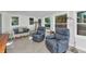 Relaxing sun room with lots of natural light with recliners and wicker couch at 3215 Cedarbrook Dr, Punta Gorda, FL 33982