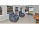Sun room features lots of natural light, reclining chairs, tile flooring, and sliding door to backyard at 3215 Cedarbrook Dr, Punta Gorda, FL 33982