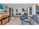 Comfortable sun room features lots of natural light, reclining chairs, tile flooring, and a wicker couch at 3215 Cedarbrook Dr, Punta Gorda, FL 33982