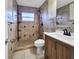 Nicely remodeled bathroom with tiled walk-in shower and modern vanity at 3420 Dawson Ln, Punta Gorda, FL 33982