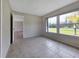 Inviting bedroom with tile flooring, neutral walls, and ample natural light at 3420 Dawson Ln, Punta Gorda, FL 33982