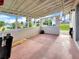 Enclosed outdoor patio area offering covered seating and backyard views at 3420 Dawson Ln, Punta Gorda, FL 33982