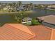 Charming waterfront property featuring a boat dock, lush tropical landscaping, and serene canal views at 3705 Toulouse Ct, Punta Gorda, FL 33950
