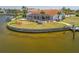 Stunning aerial view of waterfront home with mature landscaping and screened lanai on a canal at 3705 Toulouse Ct, Punta Gorda, FL 33950