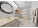 Bright bathroom featuring gray cabinets, a light countertop, tile floors, and an enclosed shower at 3705 Toulouse Ct, Punta Gorda, FL 33950