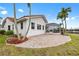Charming waterfront home with a red tile roof, paver patio, screened lanai and lush landscaping at 3705 Toulouse Ct, Punta Gorda, FL 33950