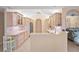 Kitchen with light wood cabinets, stainless steel appliances, and open view to the living room at 3705 Toulouse Ct, Punta Gorda, FL 33950