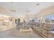 Spacious living room with large sectional, vaulted ceilings, ceiling fans and waterfront views at 3705 Toulouse Ct, Punta Gorda, FL 33950