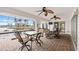 Spacious screened-in patio with waterfront views, ceiling fans, and ample seating at 3705 Toulouse Ct, Punta Gorda, FL 33950