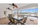Spacious screened-in patio with waterfront views, ceiling fans, and ample seating at 3705 Toulouse Ct, Punta Gorda, FL 33950