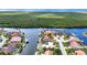 Aerial view of houses with canals and waterway access to the ocean at 3824 Aves Island Ct, Punta Gorda, FL 33950