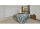 Well-lit bedroom with a queen-sized bed, carpet, ceiling fan, and a window providing natural light at 3824 Aves Island Ct, Punta Gorda, FL 33950