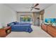 Comfortable bedroom with plush carpet, ceiling fan, and sliding doors to the lanai and pool at 3824 Aves Island Ct, Punta Gorda, FL 33950