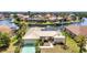 Single-story home with a metal roof, lush landscaping, and canal access at 3824 Aves Island Ct, Punta Gorda, FL 33950