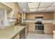 Bright kitchen with stainless steel appliances and window over sink at 3824 Aves Island Ct, Punta Gorda, FL 33950