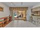 Indoor living space with tile flooring, sliding glass doors to lanai, and bar seating at 3824 Aves Island Ct, Punta Gorda, FL 33950
