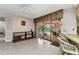 Indoor living space with tile flooring, sliding glass doors to lanai, and bar seating at 3824 Aves Island Ct, Punta Gorda, FL 33950
