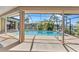 Inviting pool and lanai area with waterfront views and a screened enclosure for outdoor relaxation at 3824 Aves Island Ct, Punta Gorda, FL 33950