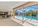 Screened pool with view of canal and sliding doors to indoor seating area at 3824 Aves Island Ct, Punta Gorda, FL 33950