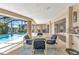 Enclosed pool area with a patio set for entertaining, waterfront views, and lush landscaping at 3824 Aves Island Ct, Punta Gorda, FL 33950
