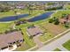 An aerial view showcases the house, pool, landscaping and golf course location at 4001 La Costa Island Ct, Punta Gorda, FL 33950