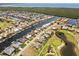 Expansive aerial view of a waterfront community with canals and golf course near the Gulf at 4001 La Costa Island Ct, Punta Gorda, FL 33950