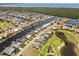 Aerial view of a waterfront community with canals and golf course near the Gulf at 4001 La Costa Island Ct, Punta Gorda, FL 33950
