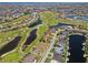 Stunning aerial view of a golf course community with lakes and beautiful homes at 4001 La Costa Island Ct, Punta Gorda, FL 33950