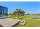 Paver patio and steps overlooking lush green golf course at 4001 La Costa Island Ct, Punta Gorda, FL 33950