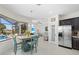 Open dining area with views of the pool, seamlessly connecting indoor and outdoor living at 4001 La Costa Island Ct, Punta Gorda, FL 33950