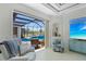 Open-concept living room overlooking the pool and outdoor living area with sliding glass doors at 4001 La Costa Island Ct, Punta Gorda, FL 33950