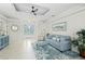 Inviting living room with tile floors, tray ceilings, and plenty of natural light at 4001 La Costa Island Ct, Punta Gorda, FL 33950