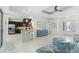 Open-concept living area with breakfast bar and views of the kitchen and entry at 4001 La Costa Island Ct, Punta Gorda, FL 33950