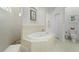 Main bathroom with a soaking tub and separate shower at 4001 La Costa Island Ct, Punta Gorda, FL 33950