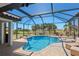 Inviting screened-in pool area with views of the golf course and lush landscaping at 4001 La Costa Island Ct, Punta Gorda, FL 33950