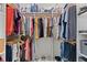 Organized walk-in closet featuring custom shelving, hanging rods, and a variety of storage options for clothing and accessories at 4001 La Costa Island Ct, Punta Gorda, FL 33950