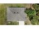 An aerial view of the home's roof, set amid trees and lush landscaping at 4127 Snowdrop St, North Port, FL 34288