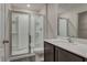 Bathroom features white shower and vanity with dark wood cabinets at 4127 Snowdrop St, North Port, FL 34288