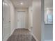 Welcoming entryway showcasing wood-look flooring and a neutral color palette at 4127 Snowdrop St, North Port, FL 34288