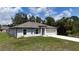 Beautiful exterior view of a single-Gathering home with a lush green lawn at 4127 Snowdrop St, North Port, FL 34288