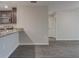 Open kitchen layout with gray cabinets, granite countertops, and modern appliances at 4127 Snowdrop St, North Port, FL 34288